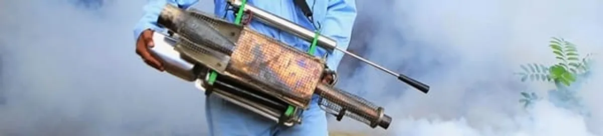 Fumigation technician using a fogger for deep pest treatment in Chattanooga, TN